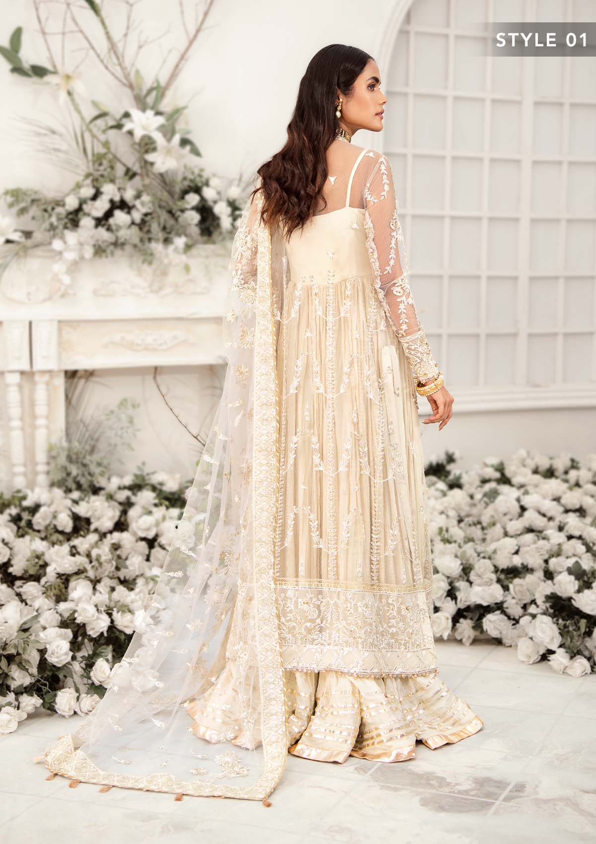 Elegant ivory net outfit with hand-embellished floral motifs, gold dipped pearls, sequins, glass beads, raw silk pants and an embroidered net dupatta luxe.