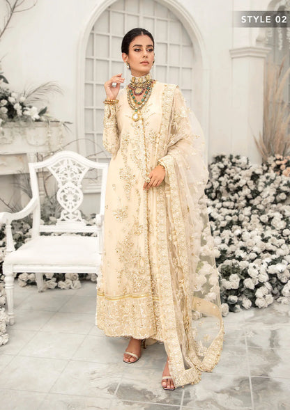 Elegant ivory net outfit with hand-embellished floral motifs, gold dipped pearls, sequins, glass beads, raw silk pants and an embroidered net dupatta luxe.
