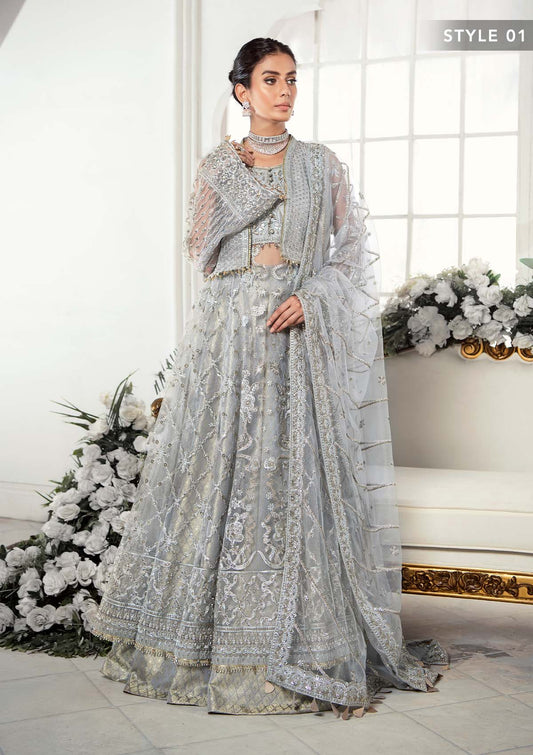 Majestic silver net ensemble featuring sequin-encrusted jaals, crystal embellished details, organza borders, raw silk pants, and an embroidered net dupatta for a timeless feminine luxury look.