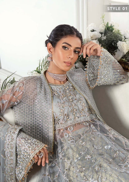 Majestic silver net ensemble featuring sequin-encrusted jaals, crystal embellished details, organza borders, raw silk pants, and an embroidered net dupatta for a timeless feminine luxury look.