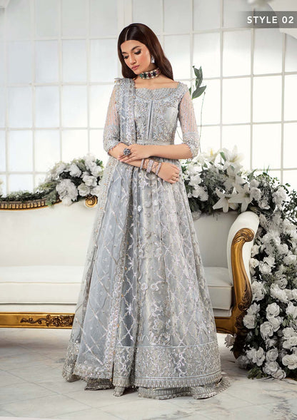 Majestic silver net ensemble featuring sequin-encrusted jaals, crystal embellished details, organza borders, raw silk pants, and an embroidered net dupatta for a timeless feminine luxury look.
