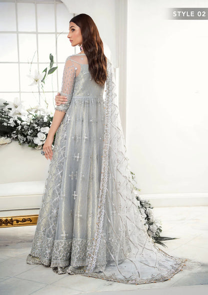 Majestic silver net ensemble featuring sequin-encrusted jaals, crystal embellished details, organza borders, raw silk pants, and an embroidered net dupatta for a timeless feminine luxury look.