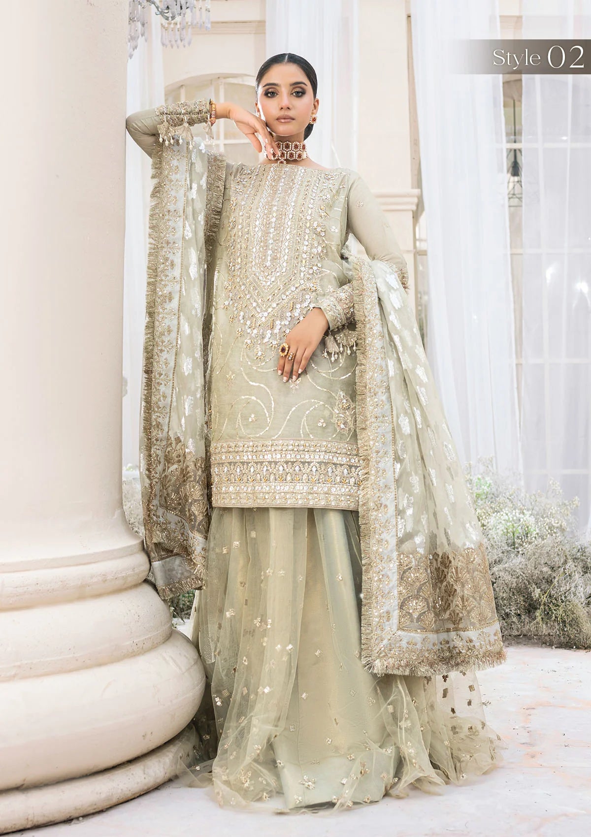 Elegant pearl grey khaadi net ensemble with Ganga-Jamuna neckline, heavy gota work, rococo-inspired motifs, masoori silk pants, and an organza jacquard dupatta.
