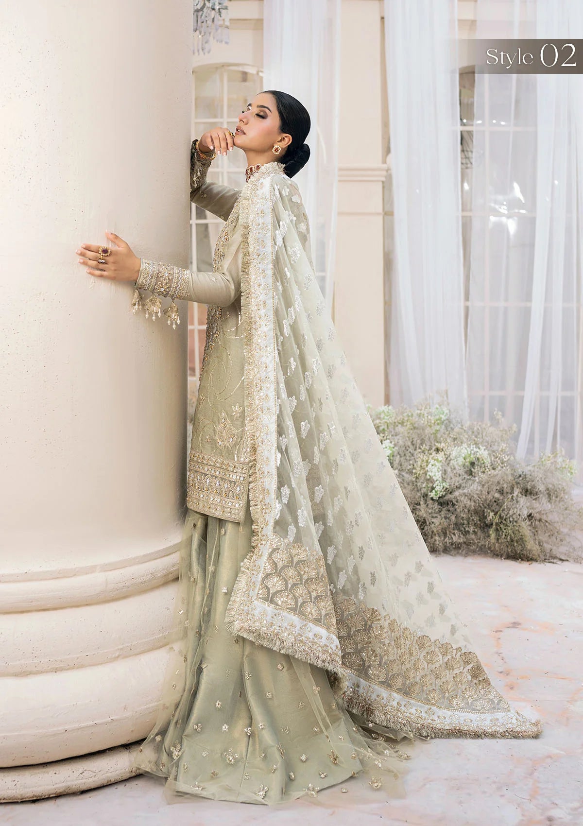 Elegant pearl grey khaadi net ensemble with Ganga-Jamuna neckline, heavy gota work, rococo-inspired motifs, masoori silk pants, and an organza jacquard dupatta.