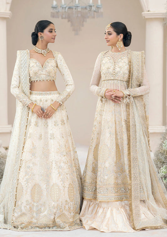 Ivory chiffon ensemble adorned with lustrous pearls and French-cut sequins, featuring rococo-inspired embroidery, jamawaar pants, and an embroidered net dupatta. Styled as blouse lehenga or kalidar frock with tiered skirt.