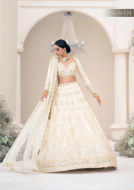 Ivory chiffon ensemble adorned with lustrous pearls and French-cut sequins, featuring rococo-inspired embroidery, jamawaar pants, and an embroidered net dupatta. Styled as blouse lehenga or kalidar frock with tiered skirt.