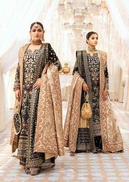 Luxurious medium silk ensemble with intricate embroidery, embellished borders, jamawaar pants, and an embroidered silk dupatta. Styled as a long shirt with gharara or izhaar pants for timeless elegance.