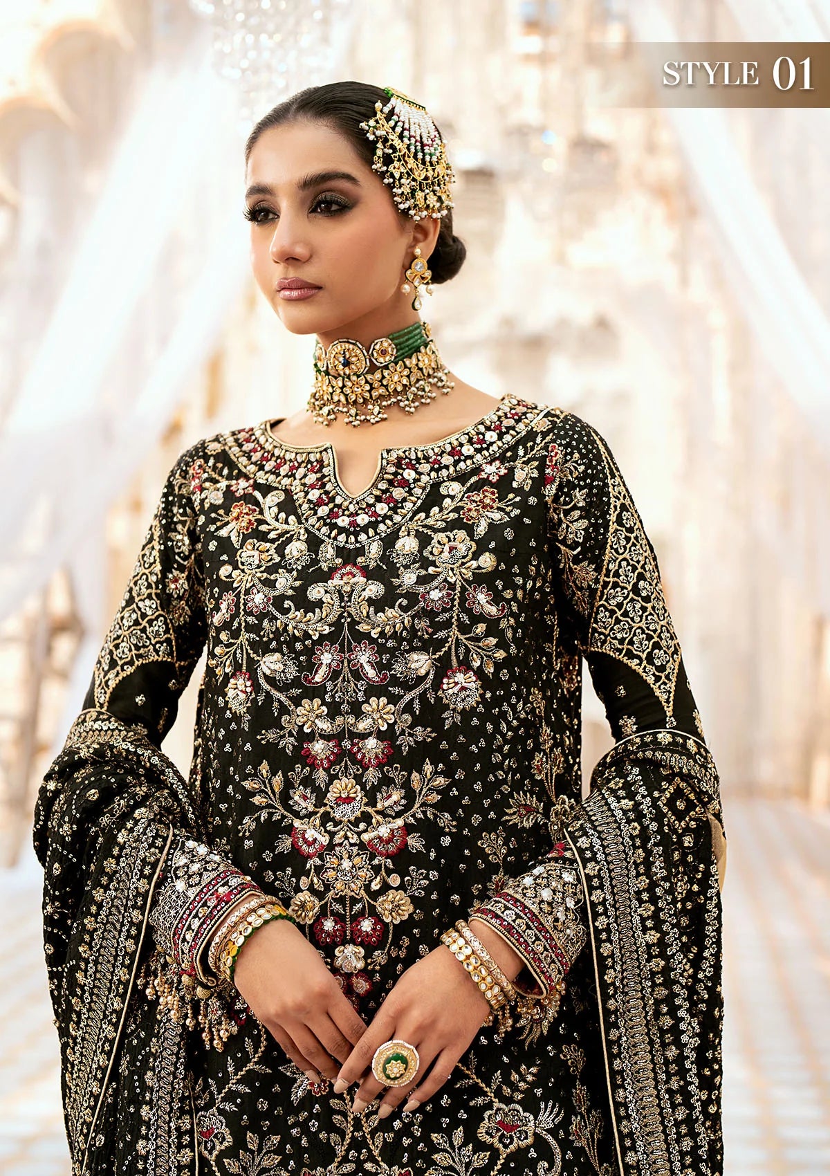 Luxurious medium silk ensemble with intricate embroidery, embellished borders, jamawaar pants, and an embroidered silk dupatta. Styled as a long shirt with gharara or izhaar pants for timeless elegance.