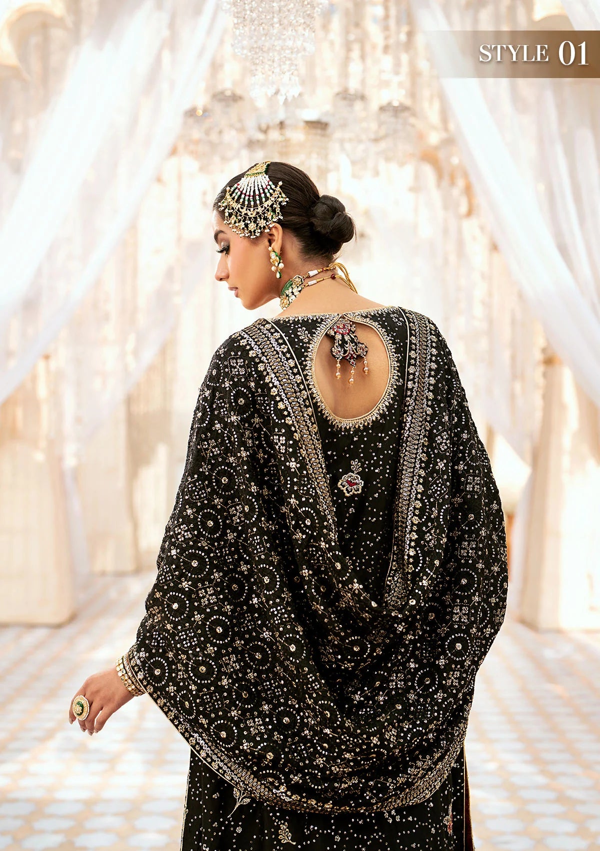 Luxurious medium silk ensemble with intricate embroidery, embellished borders, jamawaar pants, and an embroidered silk dupatta. Styled as a long shirt with gharara or izhaar pants for timeless elegance.