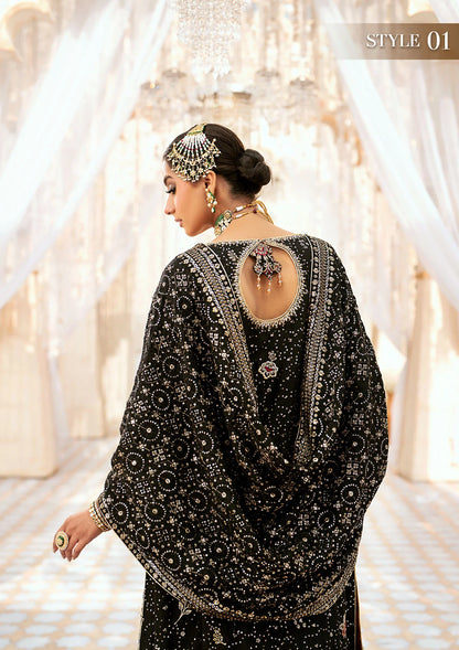 Luxurious medium silk ensemble with intricate embroidery, embellished borders, jamawaar pants, and an embroidered silk dupatta. Styled as a long shirt with gharara or izhaar pants for timeless elegance.