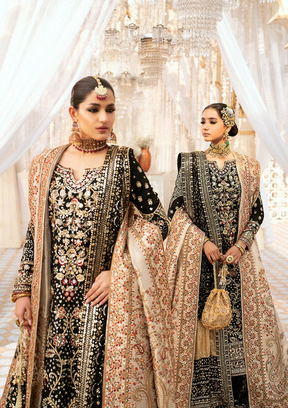 Luxurious medium silk ensemble with intricate embroidery, embellished borders, jamawaar pants, and an embroidered silk dupatta. Styled as a long shirt with gharara or izhaar pants for timeless elegance.