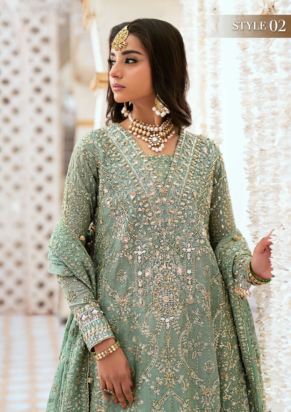 Elegant kundan zari ensemble with embellished organza neckline, detailed borders, masoori silk pants, and a chiffon dupatta. Styled as angrakha with gharara or long shirt with crushed frock.