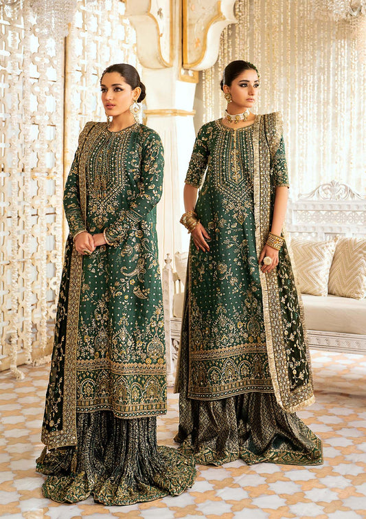 Elegant medium silk suit with rich embroidery, organza borders, jamawaar pants, and a chiffon dupatta. Styled with crushed sharara or classic gharara.