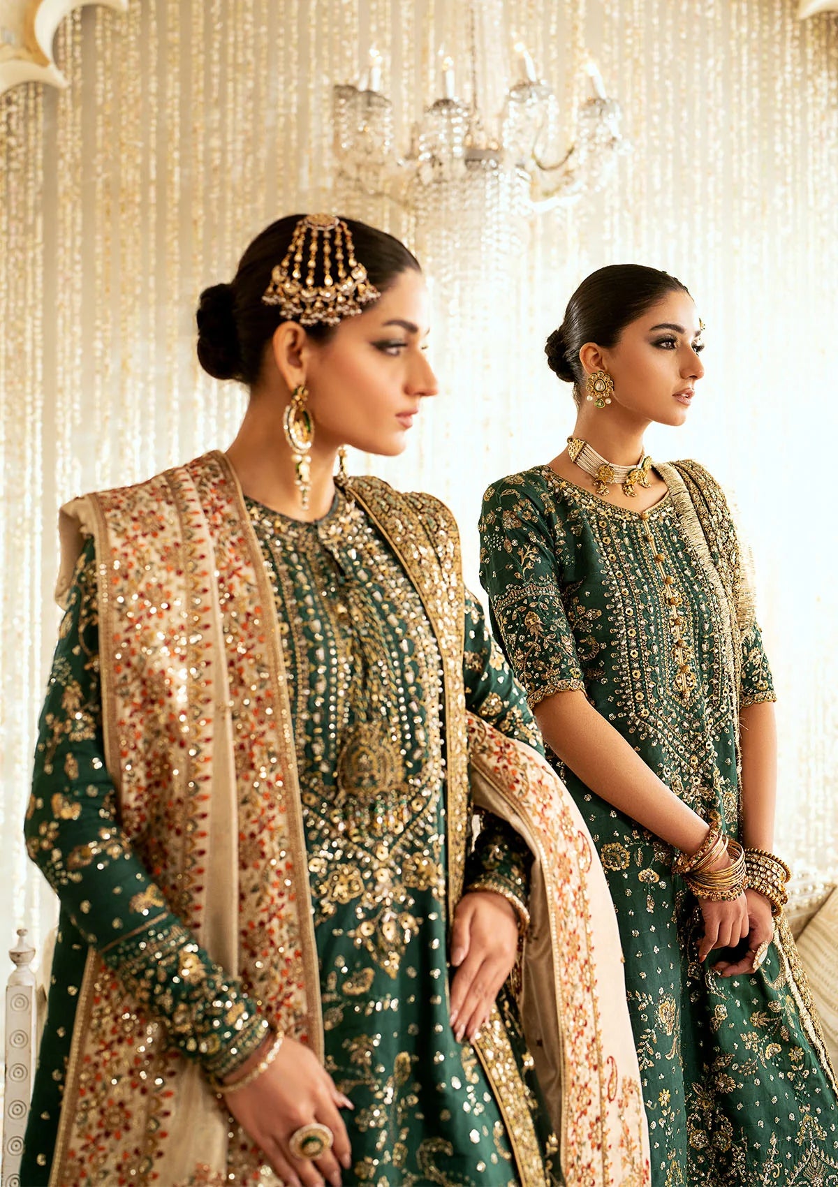 Elegant medium silk suit with rich embroidery, organza borders, jamawaar pants, and a chiffon dupatta. Styled with crushed sharara or classic gharara.