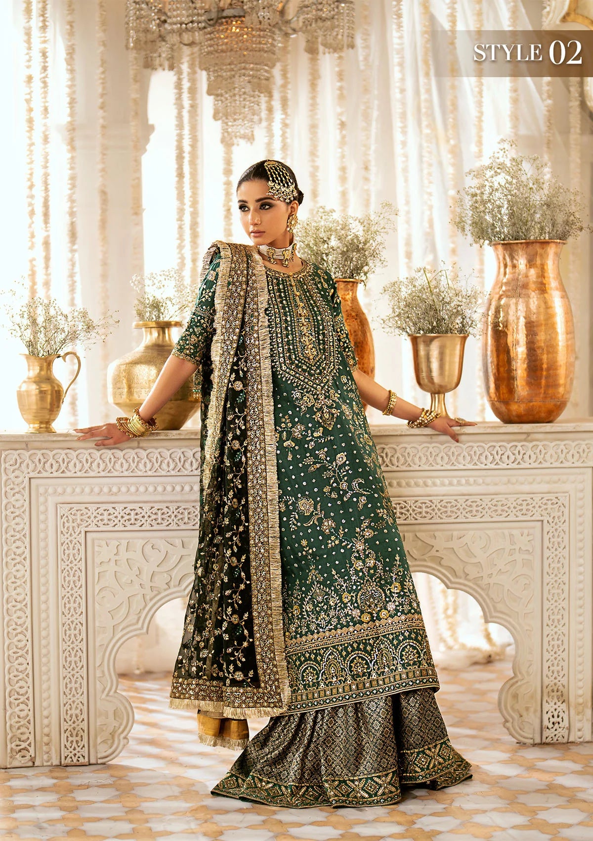Elegant medium silk suit with rich embroidery, organza borders, jamawaar pants, and a chiffon dupatta. Styled with crushed sharara or classic gharara.