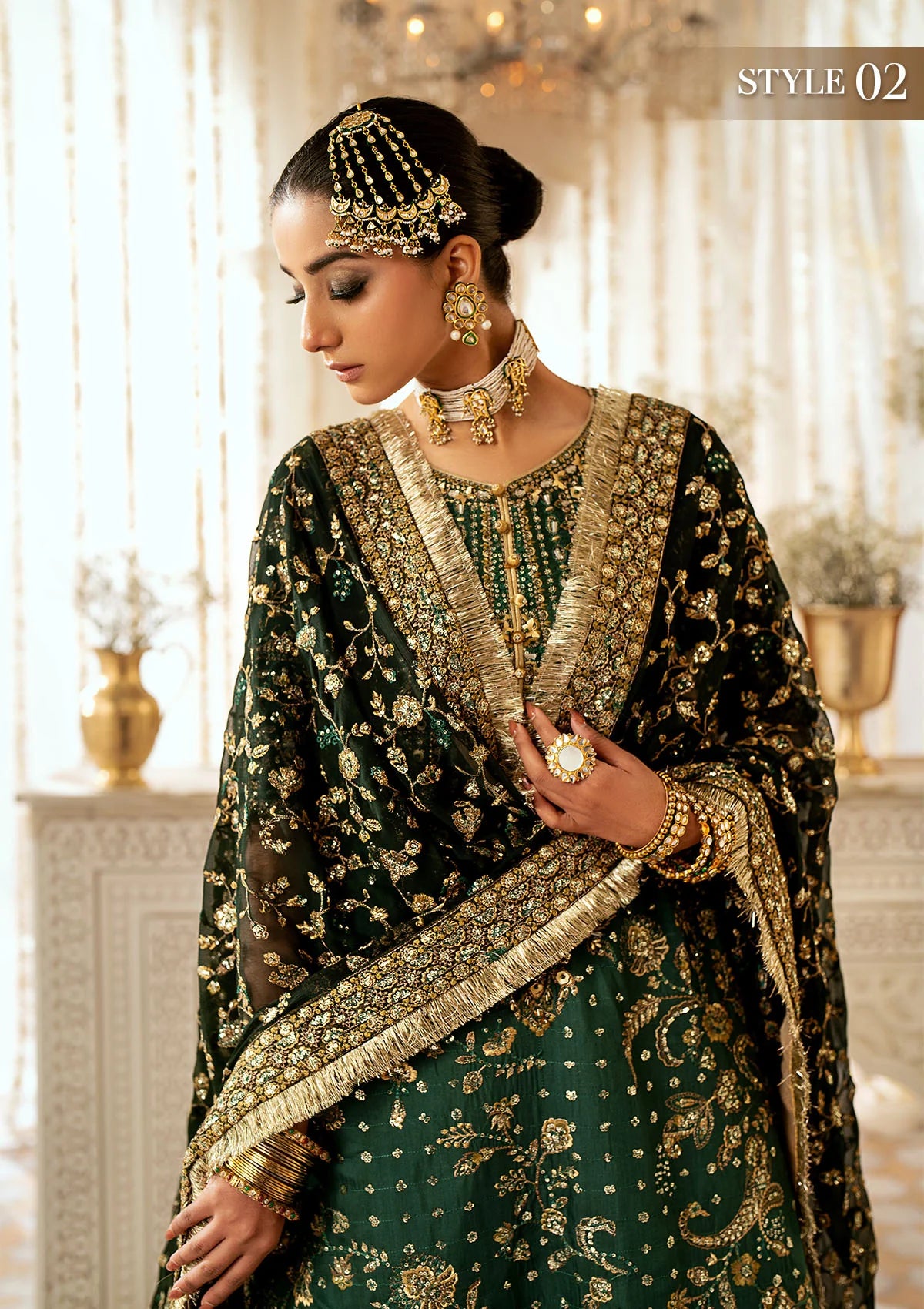 Elegant medium silk suit with rich embroidery, organza borders, jamawaar pants, and a chiffon dupatta. Styled with crushed sharara or classic gharara.