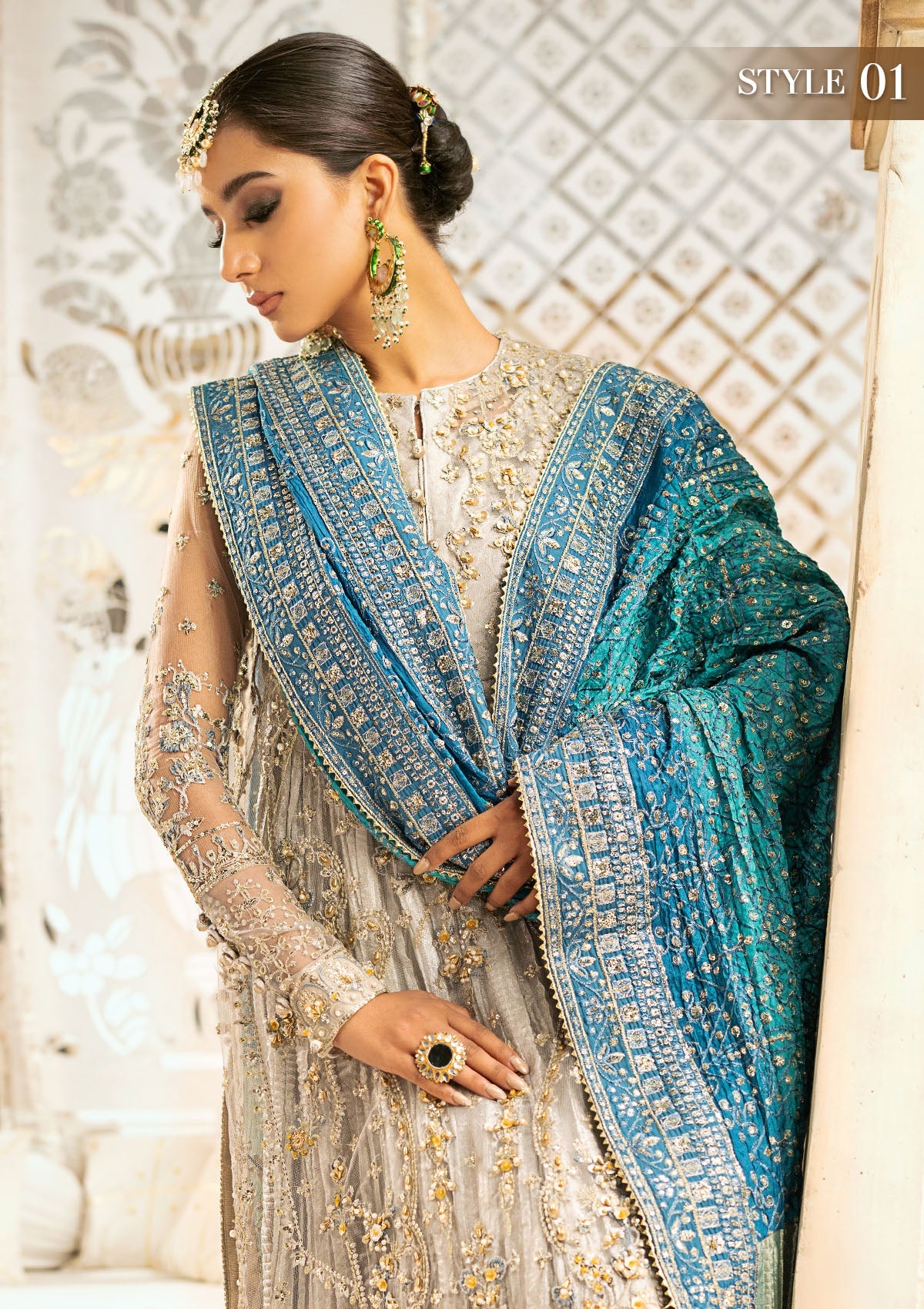 Elegant embroidered net suit featuring organza borders, jamawaar pants, and a medium silk dupatta with detailed embroidery for festive wear occasions!