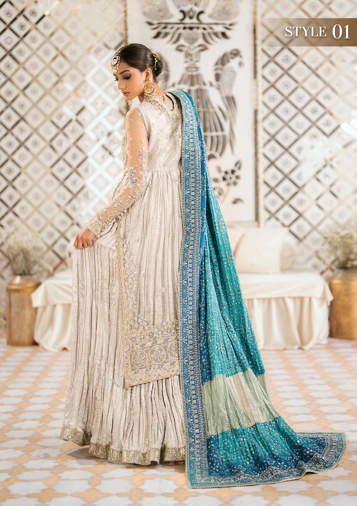 Elegant embroidered net suit featuring organza borders, jamawaar pants, and a medium silk dupatta with detailed embroidery for festive wear occasions!