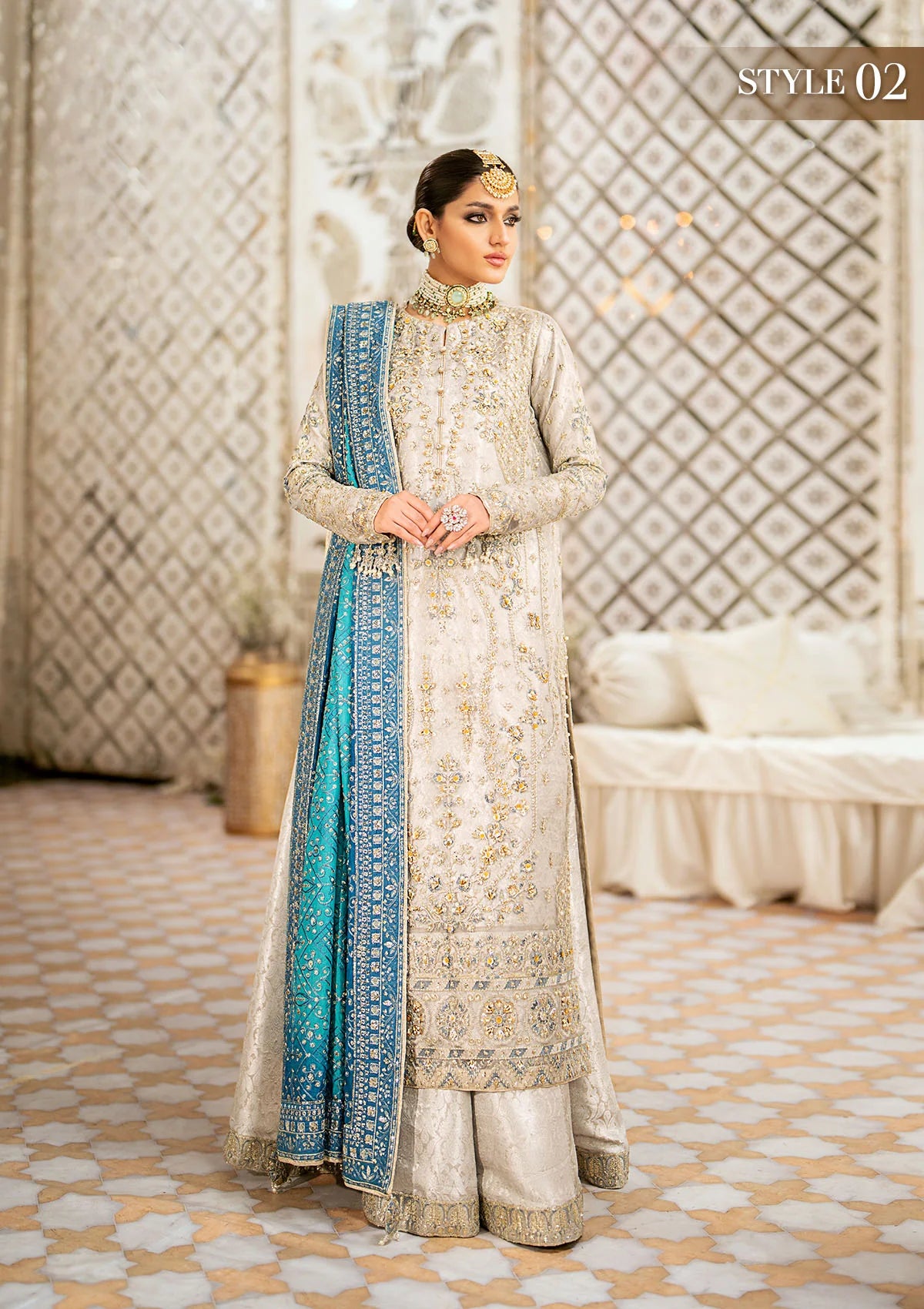 Elegant embroidered net suit featuring organza borders, jamawaar pants, and a medium silk dupatta with detailed embroidery for festive wear occasions!