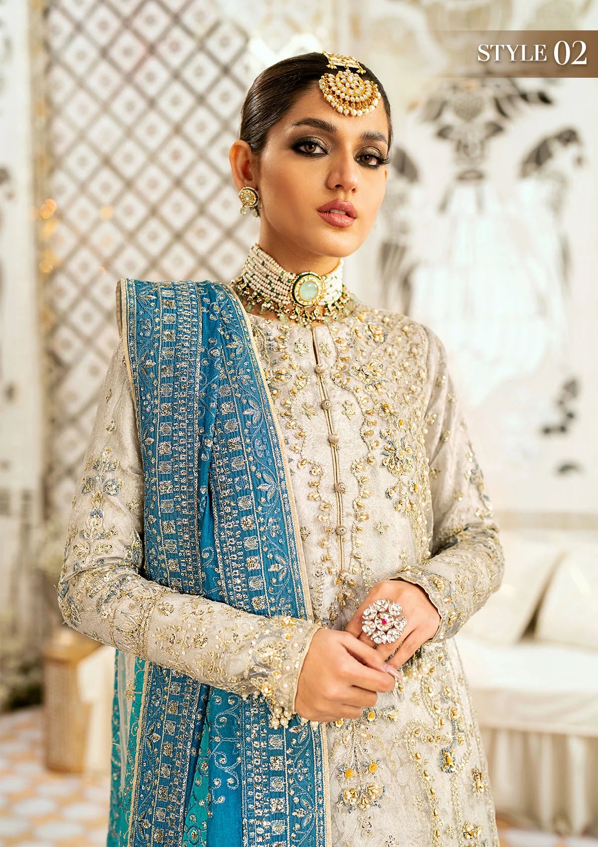 Elegant embroidered net suit featuring organza borders, jamawaar pants, and a medium silk dupatta with detailed embroidery for festive wear occasions!