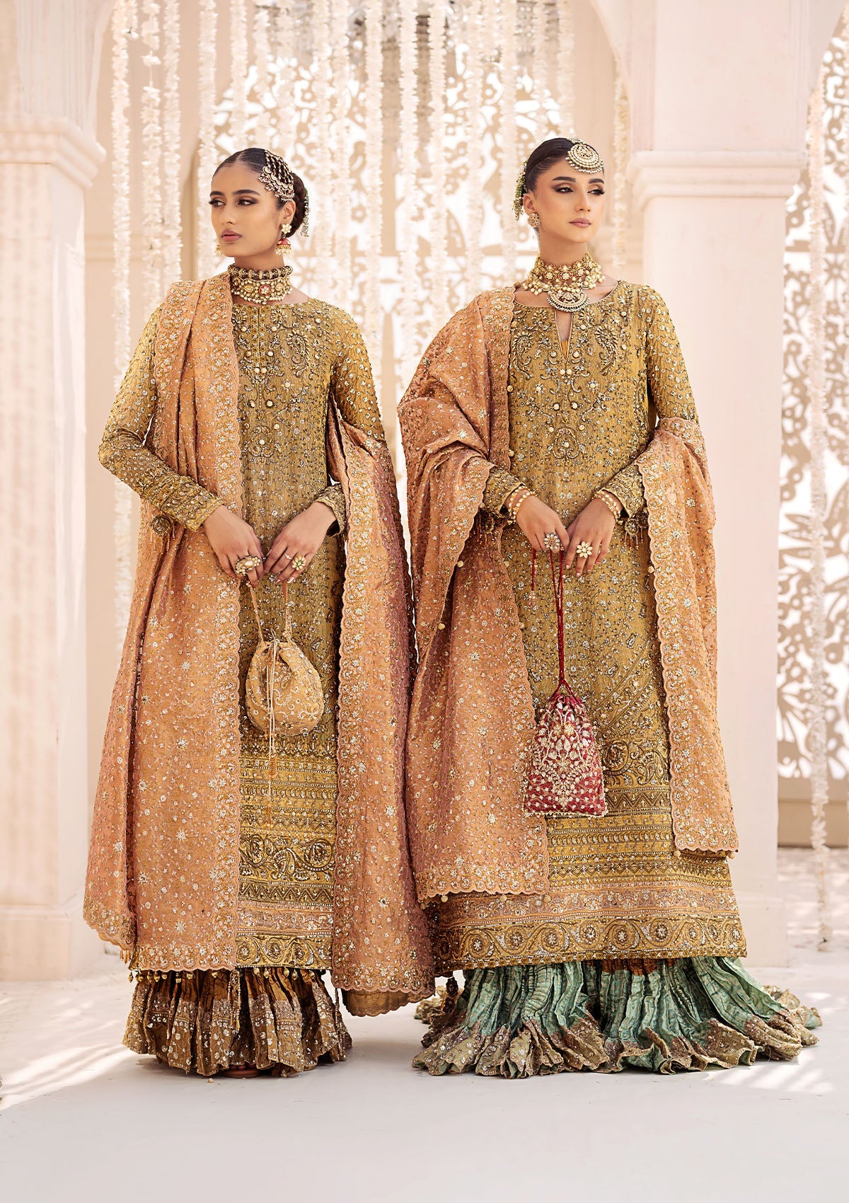 Opulent kundan zari ensemble with rich embroidery, tissue borders, masoori silk pants, and an embroidered tissue dupatta. Styled as a long shirt with crushed frock or farshi gharara for regal elegance.