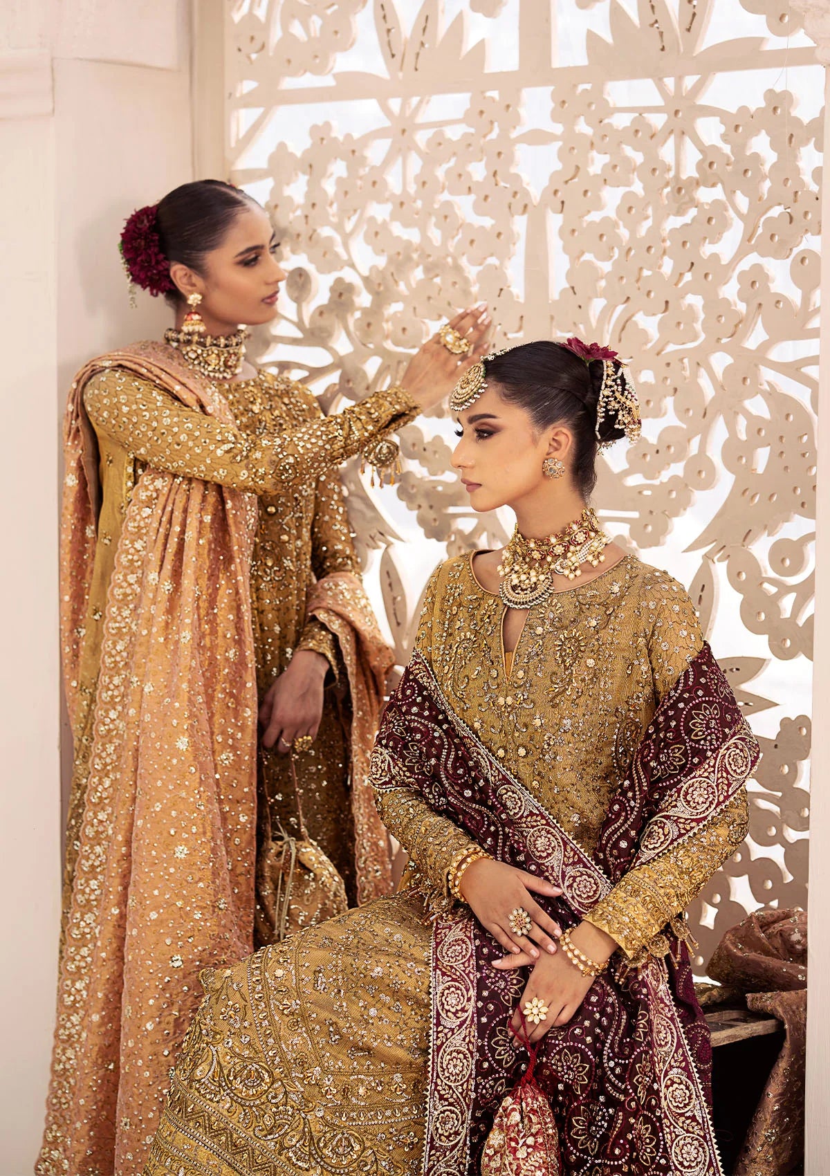 Opulent kundan zari ensemble with rich embroidery, tissue borders, masoori silk pants, and an embroidered tissue dupatta. Styled as a long shirt with crushed frock or farshi gharara for regal elegance.