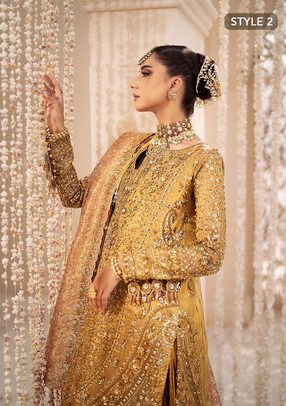 Opulent kundan zari ensemble with rich embroidery, tissue borders, masoori silk pants, and an embroidered tissue dupatta. Styled as a long shirt with crushed frock or farshi gharara for regal elegance.