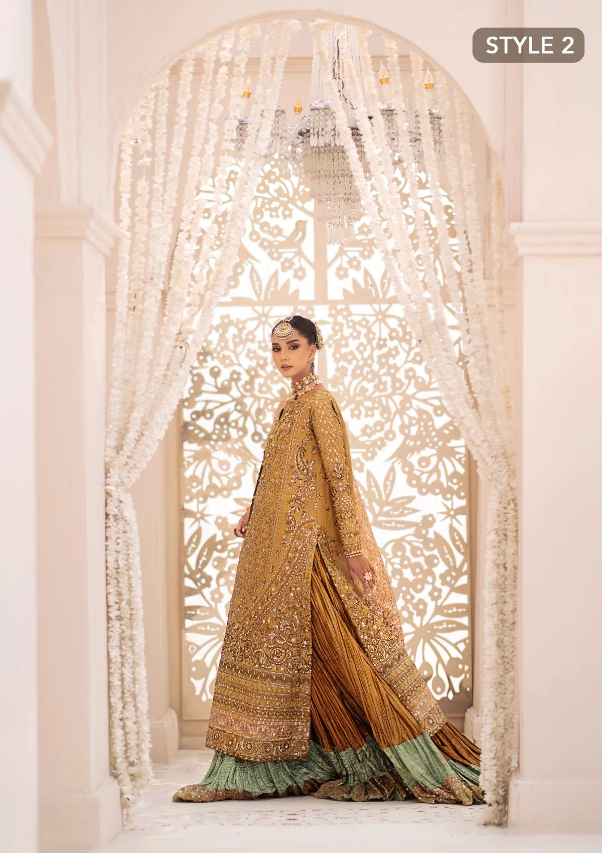 Opulent kundan zari ensemble with rich embroidery, tissue borders, masoori silk pants, and an embroidered tissue dupatta. Styled as a long shirt with crushed frock or farshi gharara for regal elegance.
