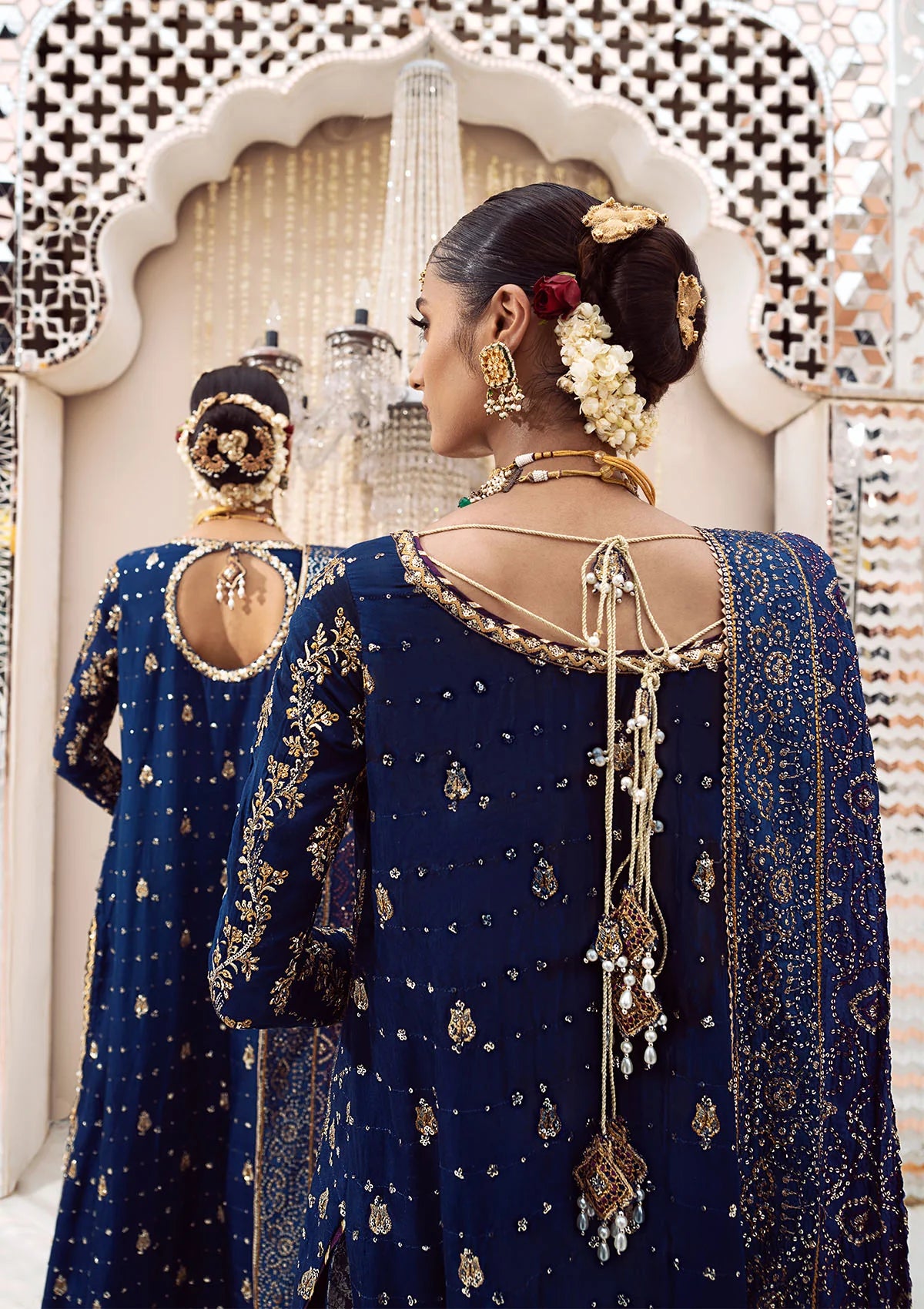Luxurious medium silk outfit with rich embroidery, organza borders, jamawaar pants, and an embroidered silk dupatta. Styled as gharara or izhaar pants.