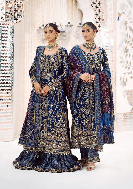 Luxurious medium silk outfit with rich embroidery, organza borders, jamawaar pants, and an embroidered silk dupatta. Styled as gharara or izhaar pants.
