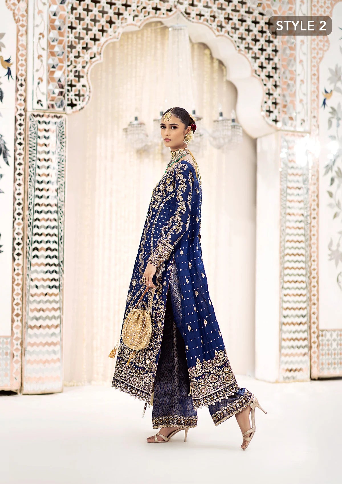 Luxurious medium silk outfit with rich embroidery, organza borders, jamawaar pants, and an embroidered silk dupatta. Styled as gharara or izhaar pants.