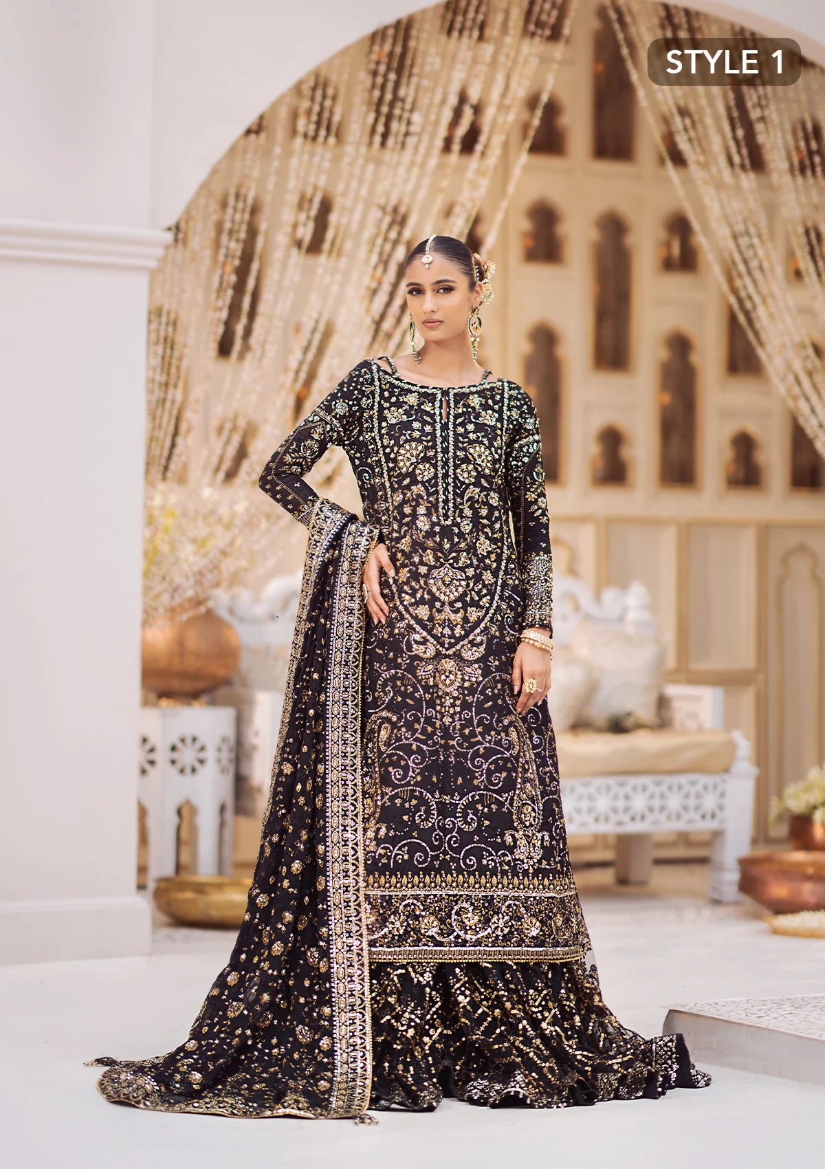 Elegant khaadi net ensemble with embellished organza borders, masoori silk pants, and chiffon dupatta. Styled as long shirt with gharara or crushed frock style.