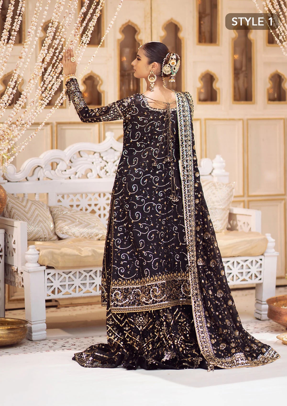 Elegant khaadi net ensemble with embellished organza borders, masoori silk pants, and chiffon dupatta. Styled as long shirt with gharara or crushed frock style.