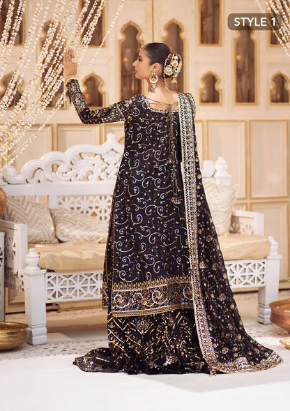 Elegant khaadi net ensemble with embellished organza borders, masoori silk pants, and chiffon dupatta. Styled as long shirt with gharara or crushed frock style.