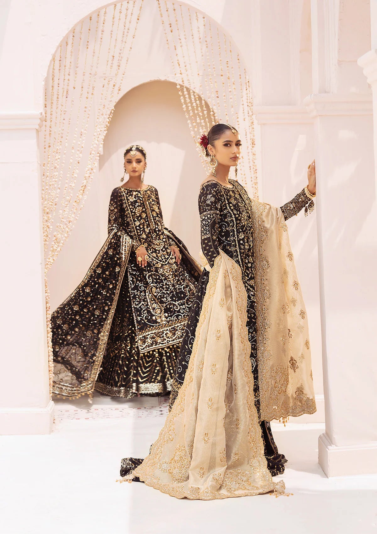 Elegant khaadi net ensemble with embellished organza borders, masoori silk pants, and chiffon dupatta. Styled as long shirt with gharara or crushed frock style.