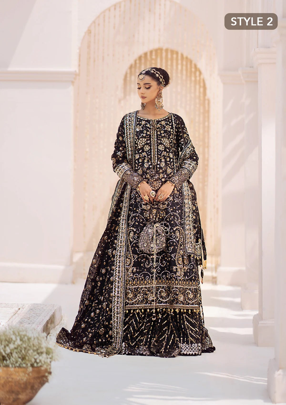 Elegant khaadi net ensemble with embellished organza borders, masoori silk pants, and chiffon dupatta. Styled as long shirt with gharara or crushed frock style.