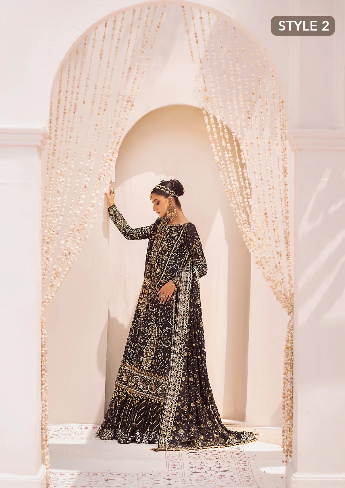 Elegant khaadi net ensemble with embellished organza borders, masoori silk pants, and chiffon dupatta. Styled as long shirt with gharara or crushed frock style.