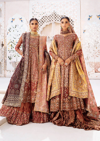 Graceful zari net ensemble with embellished bodice, organza borders, masoori silk pants, and an embroidered tissue dupatta. Styled as kalidaar frock with crushed farshi lehnga or angrakha with crushed sharara.