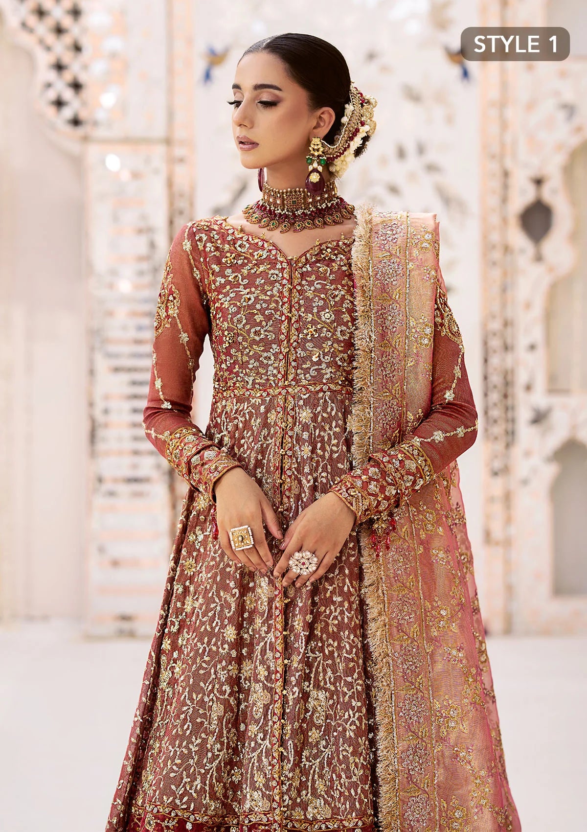 Graceful zari net ensemble with embellished bodice, organza borders, masoori silk pants, and an embroidered tissue dupatta. Styled as kalidaar frock with crushed farshi lehnga or angrakha with crushed sharara.