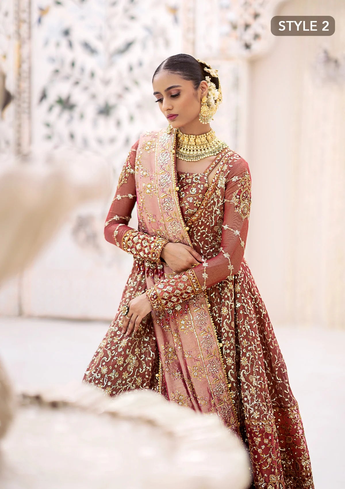Graceful zari net ensemble with embellished bodice, organza borders, masoori silk pants, and an embroidered tissue dupatta. Styled as kalidaar frock with crushed farshi lehnga or angrakha with crushed sharara.