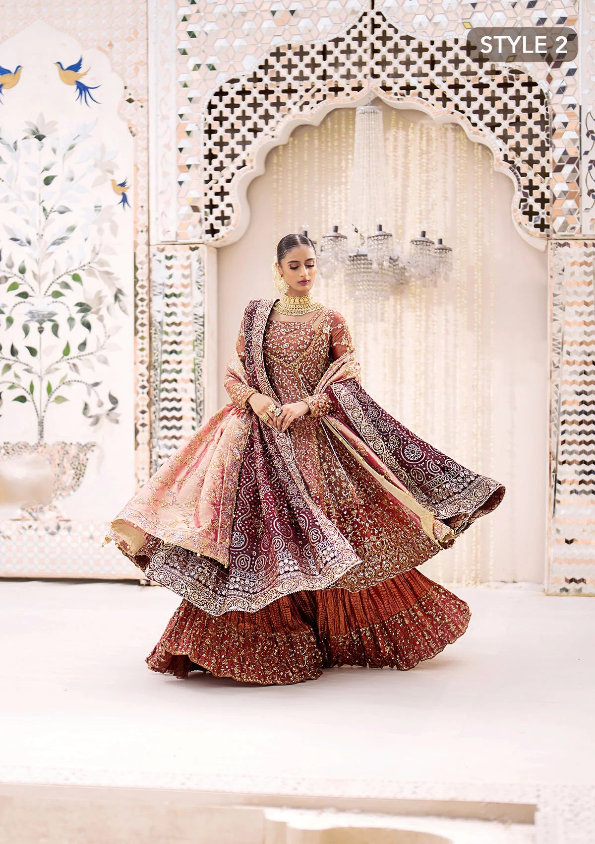 Graceful zari net ensemble with embellished bodice, organza borders, masoori silk pants, and an embroidered tissue dupatta. Styled as kalidaar frock with crushed farshi lehnga or angrakha with crushed sharara.