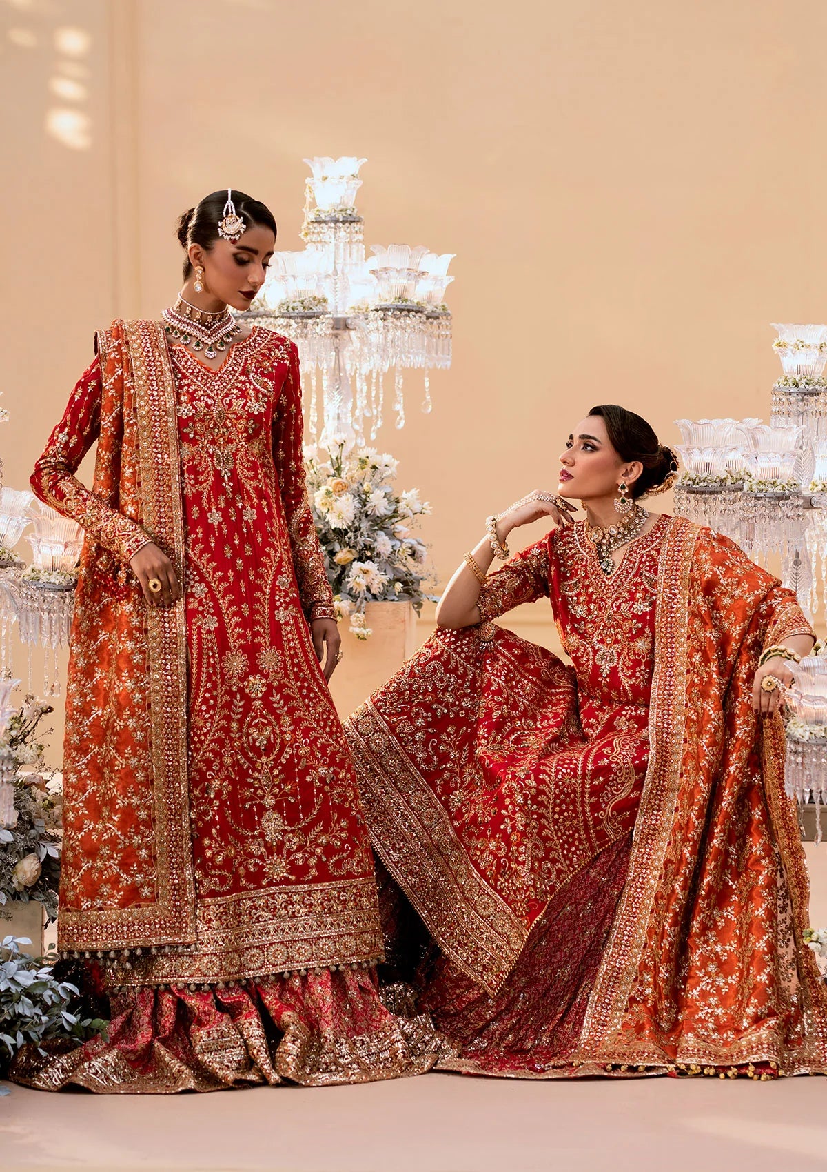 Elegant medium silk ensemble with rich embroidery, embellished borders, embroidered jamawaar pants, and a tissue dupatta. Styled as a long shirt with farshi gharara or crushed gharara for festive wear.