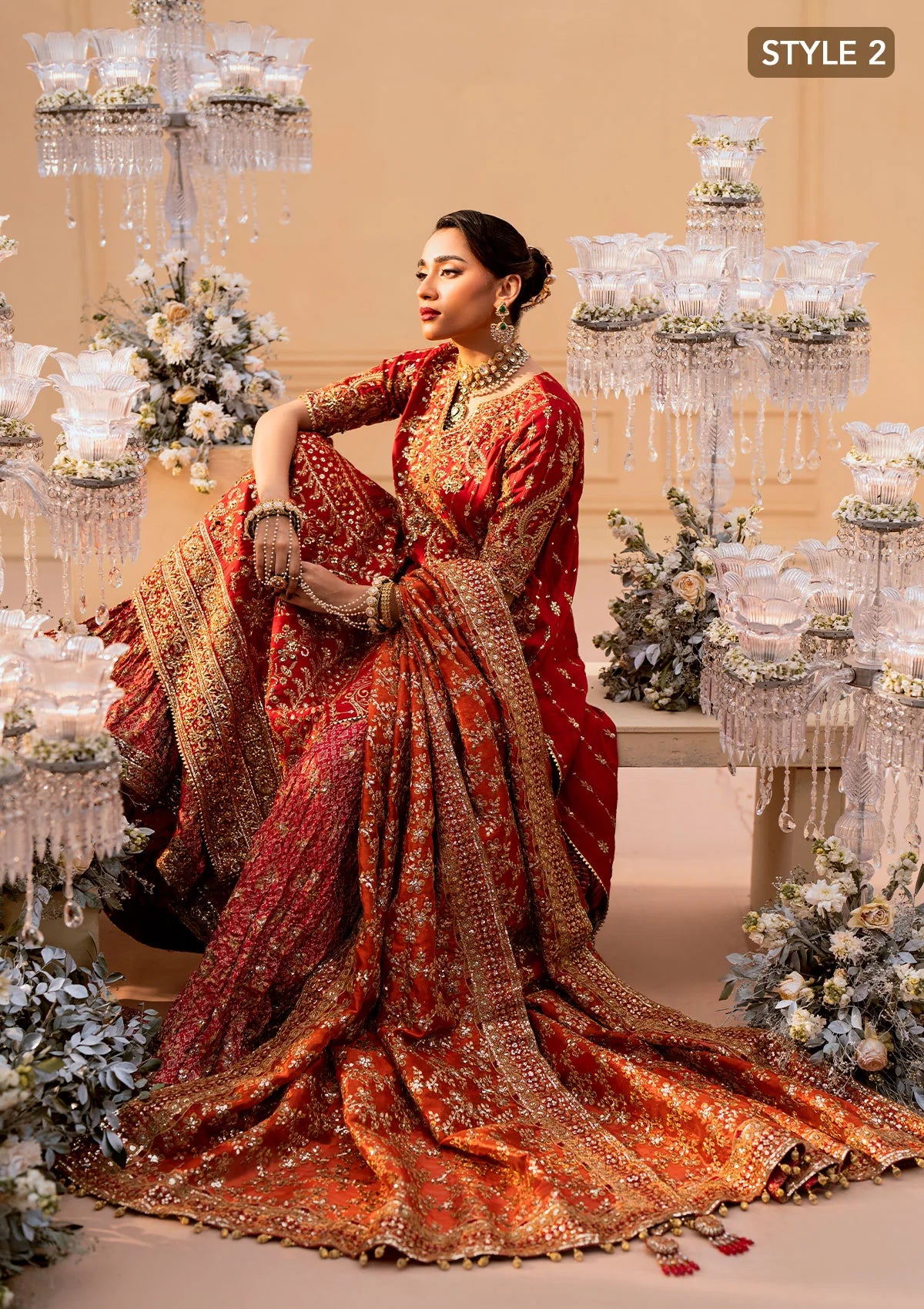 Elegant medium silk ensemble with rich embroidery, embellished borders, embroidered jamawaar pants, and a tissue dupatta. Styled as a long shirt with farshi gharara or crushed gharara for festive wear.