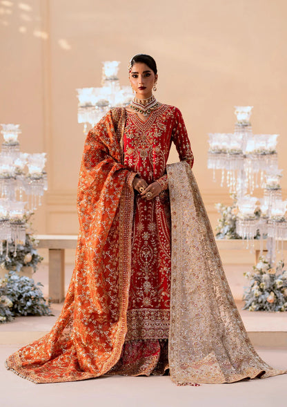 Elegant medium silk ensemble with rich embroidery, embellished borders, embroidered jamawaar pants, and a tissue dupatta. Styled as a long shirt with farshi gharara or crushed gharara for festive wear.
