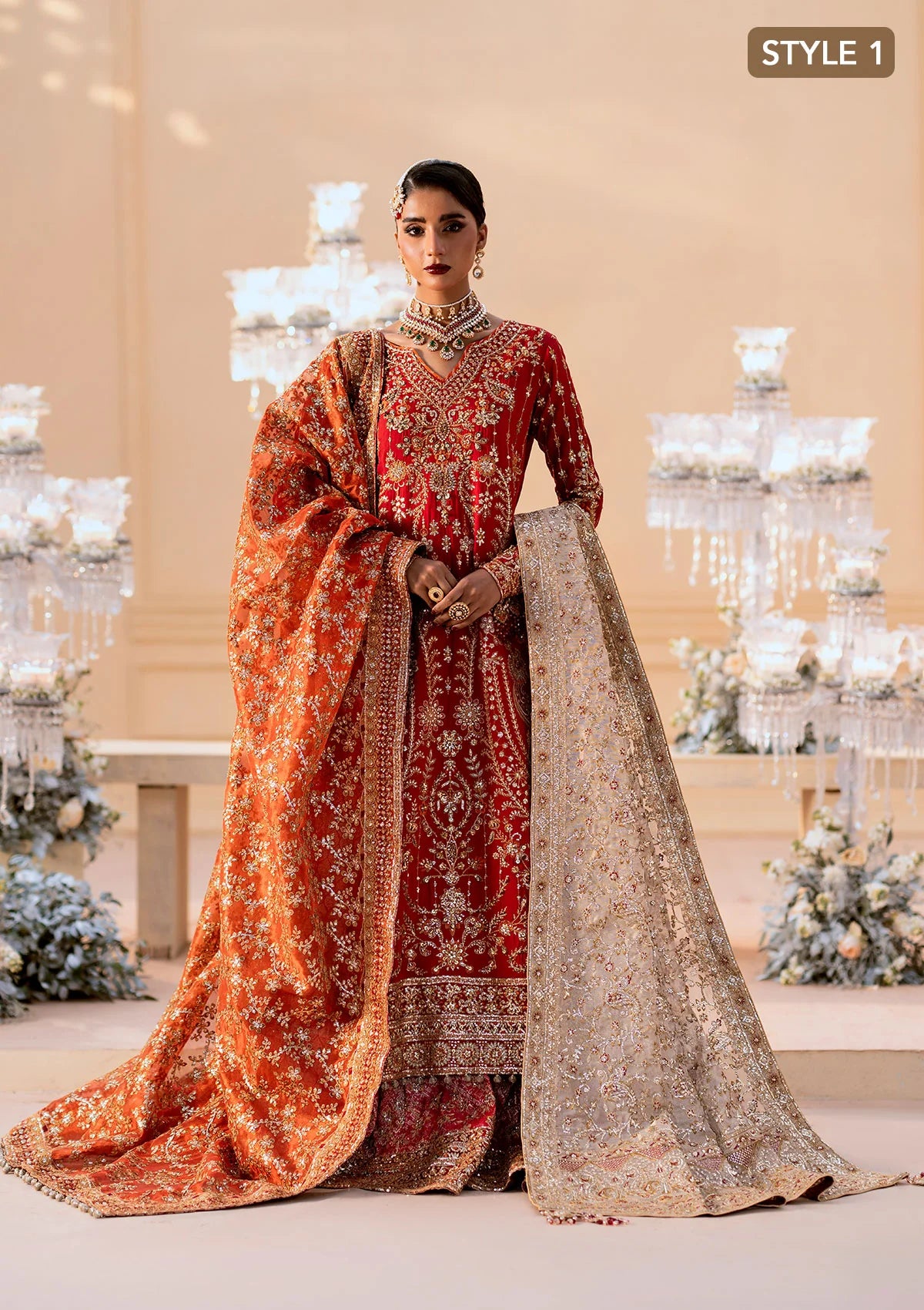 Elegant medium silk ensemble with rich embroidery, embellished borders, embroidered jamawaar pants, and a tissue dupatta. Styled as a long shirt with farshi gharara or crushed gharara for festive wear.