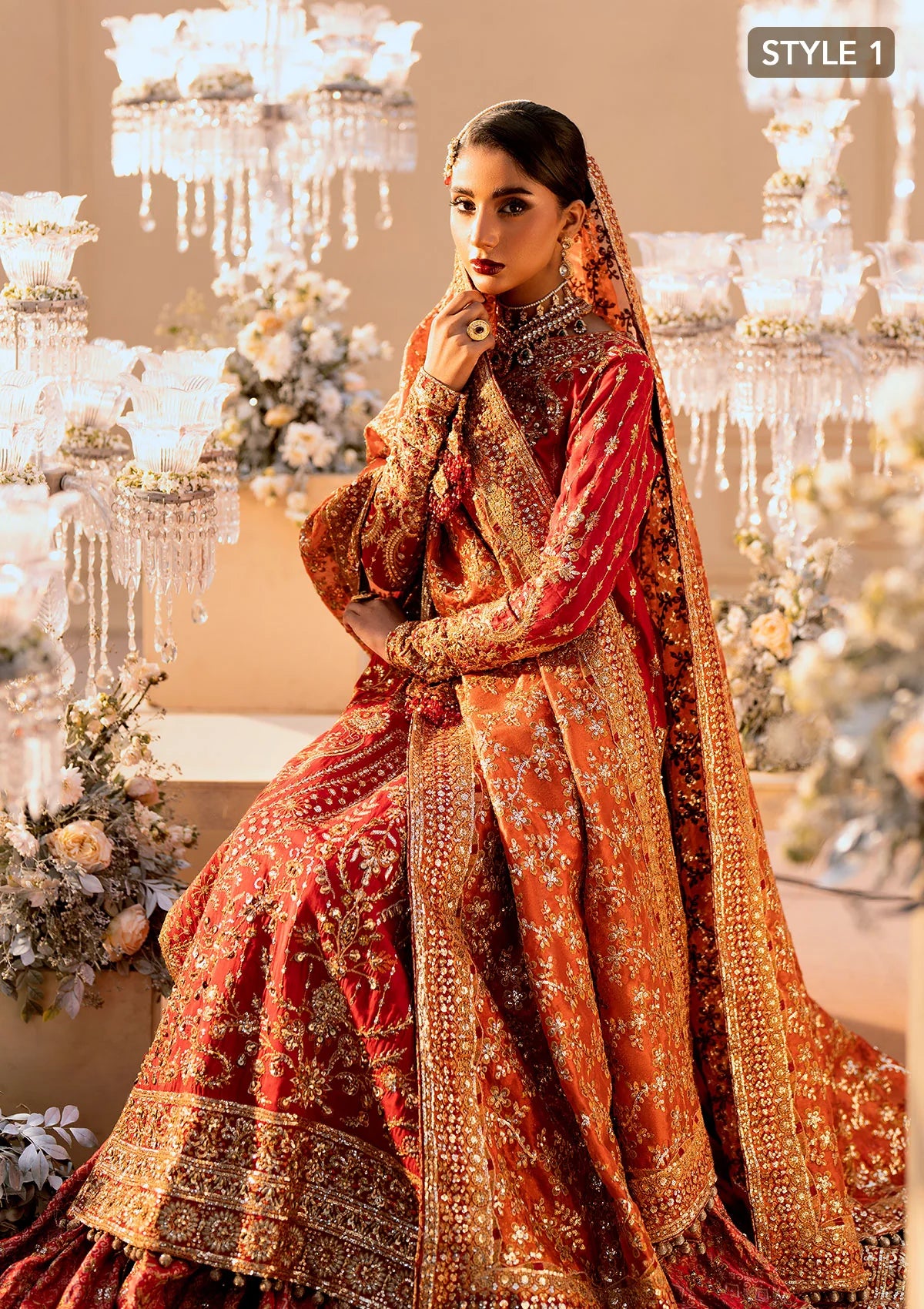 Elegant medium silk ensemble with rich embroidery, embellished borders, embroidered jamawaar pants, and a tissue dupatta. Styled as a long shirt with farshi gharara or crushed gharara for festive wear.