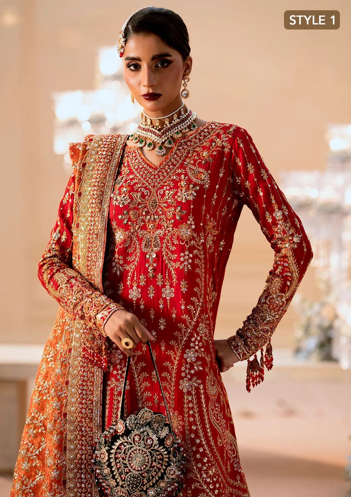 Elegant medium silk ensemble with rich embroidery, embellished borders, embroidered jamawaar pants, and a tissue dupatta. Styled as a long shirt with farshi gharara or crushed gharara for festive wear.