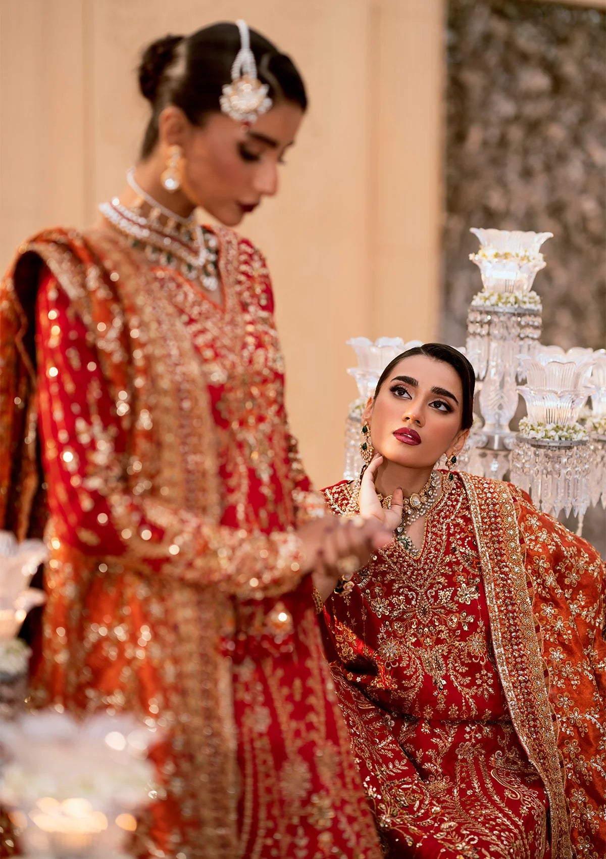 Elegant medium silk ensemble with rich embroidery, embellished borders, embroidered jamawaar pants, and a tissue dupatta. Styled as a long shirt with farshi gharara or crushed gharara for festive wear.