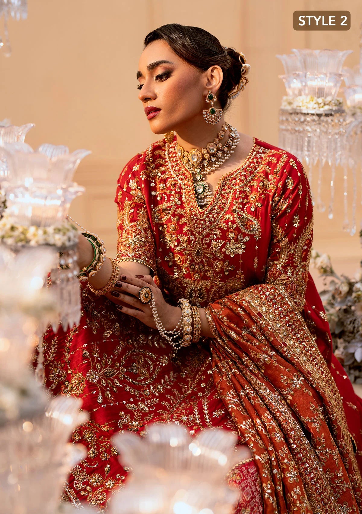 Elegant medium silk ensemble with rich embroidery, embellished borders, embroidered jamawaar pants, and a tissue dupatta. Styled as a long shirt with farshi gharara or crushed gharara for festive wear.