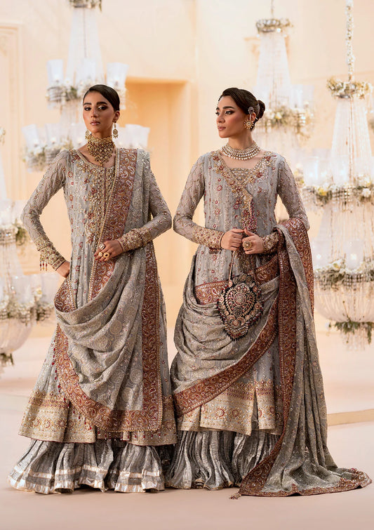Graceful embroidered chiffon ensemble with organza neckline, silk and organza borders, jamawaar pants, and a chiffon dupatta. Styled as kalidar open front or angrakha sharara.